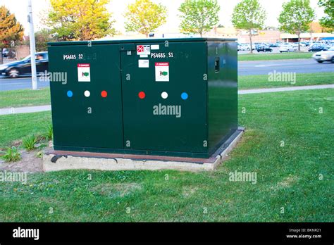 big green electrical boxes|green electrical box in street.